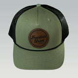 Green and black snapback hat with mesh back and Freedom Union logo patch