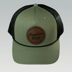 Green and black snapback hat with mesh back and Freedom Union logo patch