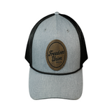 Gray and black cap with a brown leather patch featuring 'Freedom Union' on a white background