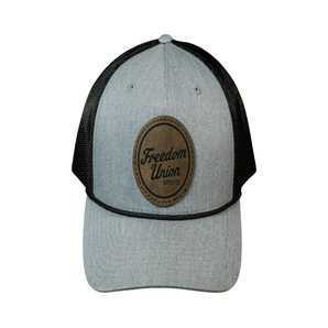 Gray and black cap with a brown leather patch featuring 'Freedom Union' on a white background