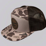 Camouflage-patterned cap with black mesh back on a light gray background