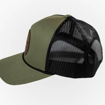 Green baseball cap with black mesh back on a white background