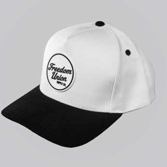 White cap with black brim and logo on a light gray background