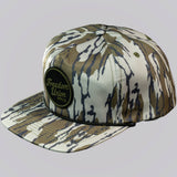 Camouflage-patterned cap with 'Freedom Union' logo on a light gray background