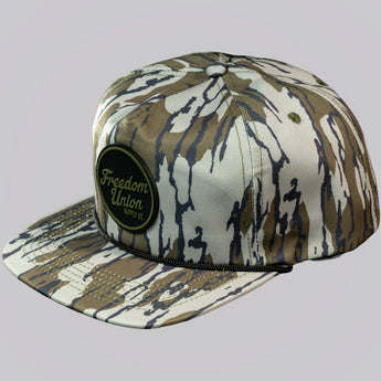 Camouflage-patterned cap with 'Freedom Union' logo on a light gray background