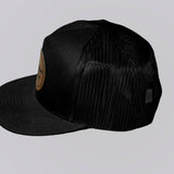 Black mesh cap with a logo on a light gray background