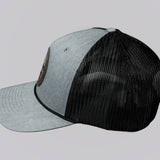 Two baseball caps, one gray and one black, on a light gray background