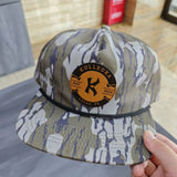 Camo snapback hat with orange Kulleoka Lucas TX patch on front