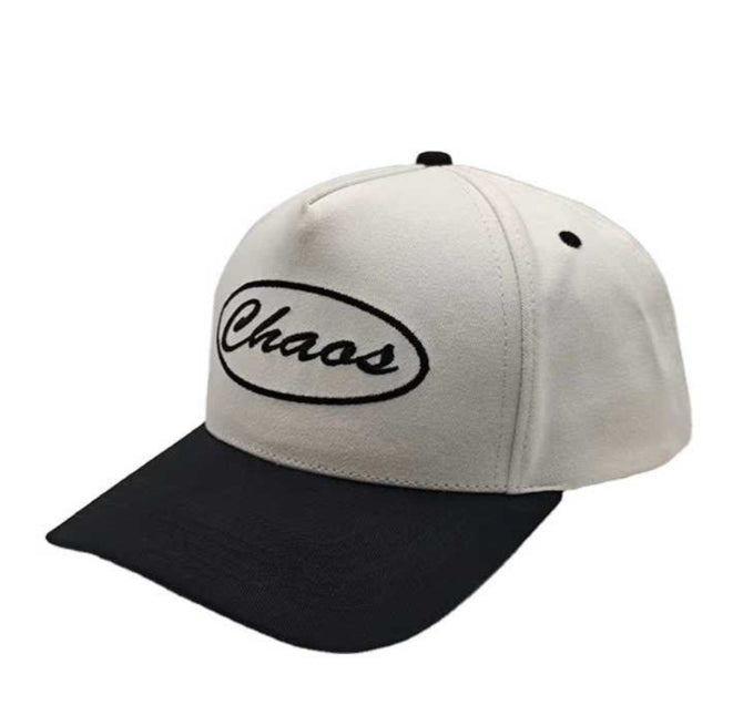 White and black cap with “Chaos” embroidered on the front panel