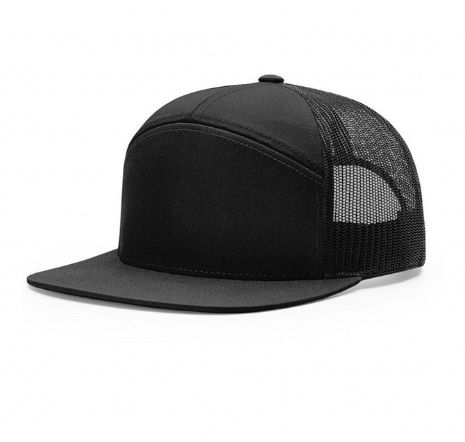 Solid black trucker cap with black mesh back and curved bill