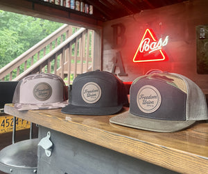 Brown duck camo trucker hat with mesh back beige and green Freedom Union patch