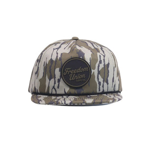 Camo snapback hat with circular black Freedom Union logo patch