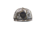 Camo snapback hat with circular black Freedom Union logo patch