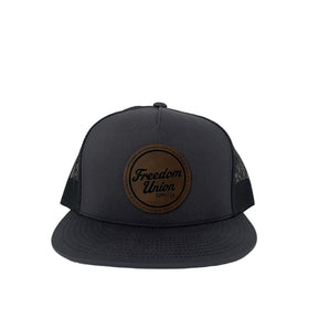 Gray and black snapback hat with mesh back and leather-look Freedom Union patch