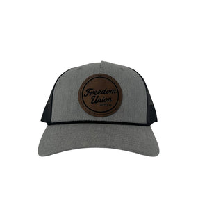 Gray twill snapback hat with mesh back and brown Freedom Union patch