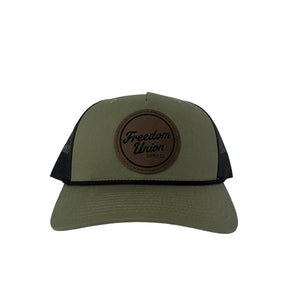 Green and black snapback hat with mesh back and Freedom Union logo patch