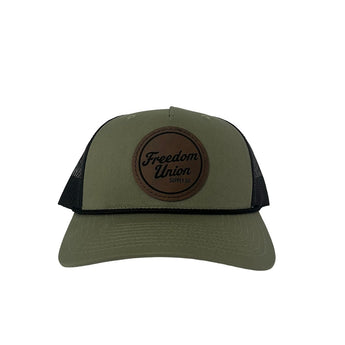 Green and black snapback hat with mesh back and Freedom Union logo patch