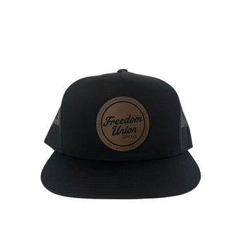 Black snapback hat with mesh back and brown Freedom Union logo patch