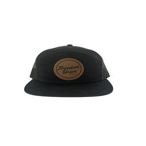 Youth black trucker snapback hat with mesh back and logo patch