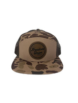 Brown duck camo trucker hat with mesh back and Freedom Union patch